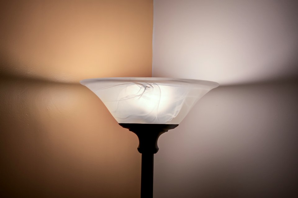 Turned On White And Black Torchiere Lamp