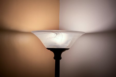 Turned On White And Black Torchiere Lamp photo