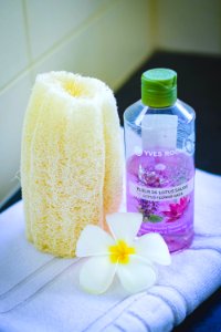 Shallow Focus Photography Of Yves Rocher Bubble Bath Bottle On White Towel photo