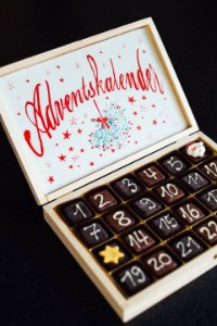 Chocolates On White Wooden Box