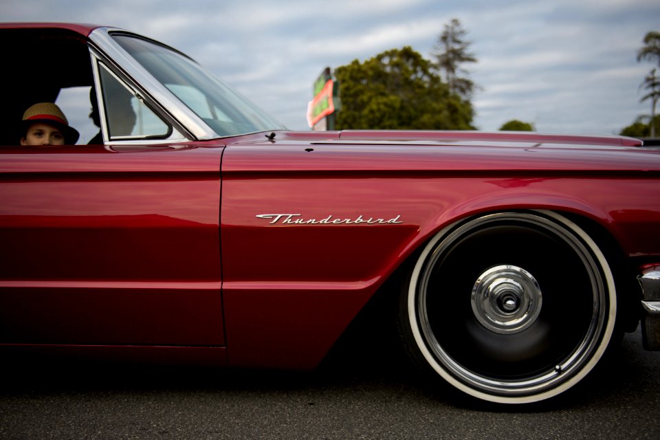 People Inside Red Thunderbird Car