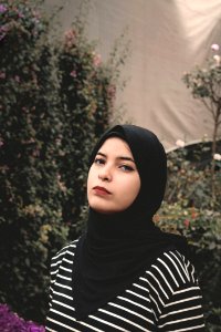 Woman Wearing Black And White Striped Top And Black Veil photo