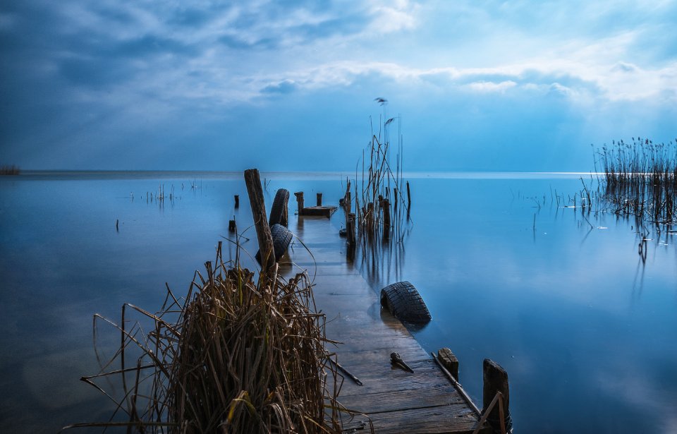 Brown Wooden Dock During Sunset
