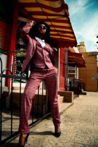 Woman In Red Blazer With Waistcoat And Dress Pants Set photo