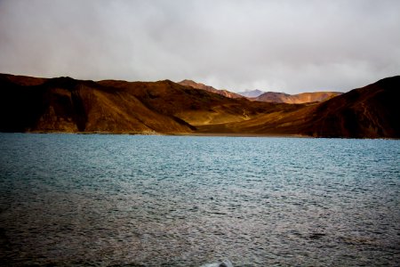 Photo Of Mountains Near The Sea photo