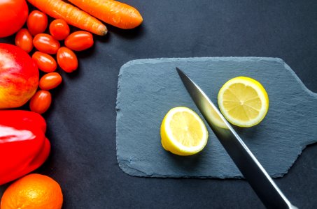 Sliced Lemon On Gray Chopping Board