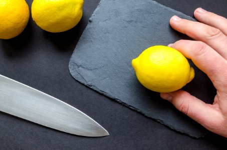 Person Holding A Lemon photo