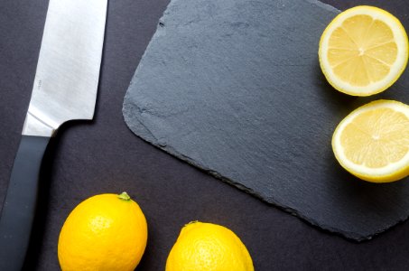 Photography Of Sliced Lemon Near Kitchen Knife photo