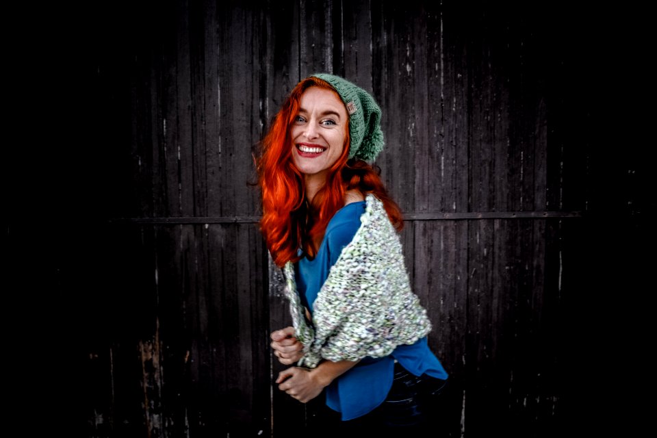 Woman In Blue Shirt An White Scarf With Red Hair