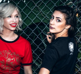 Woman Wearing Black Shirt Beside Woman Wearing Red Shirt photo