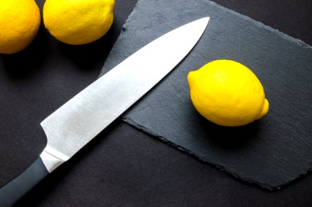 Photography Of Lemon Near Kitchen Knife photo