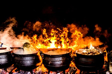 Time Lapse Photography Of Four Black Metal Cooking Wares
