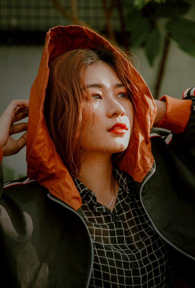 Woman Wearing Orange And Black Zip-up Jacket