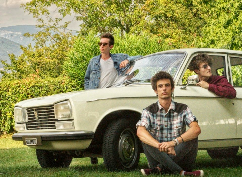 Shallow Focus Photography Of Three Men With White Car Surrounded Of Trees