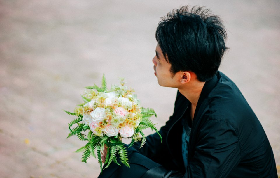 Person Holding Bouquet Of Roses