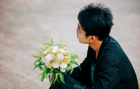 Person Holding Bouquet Of Roses