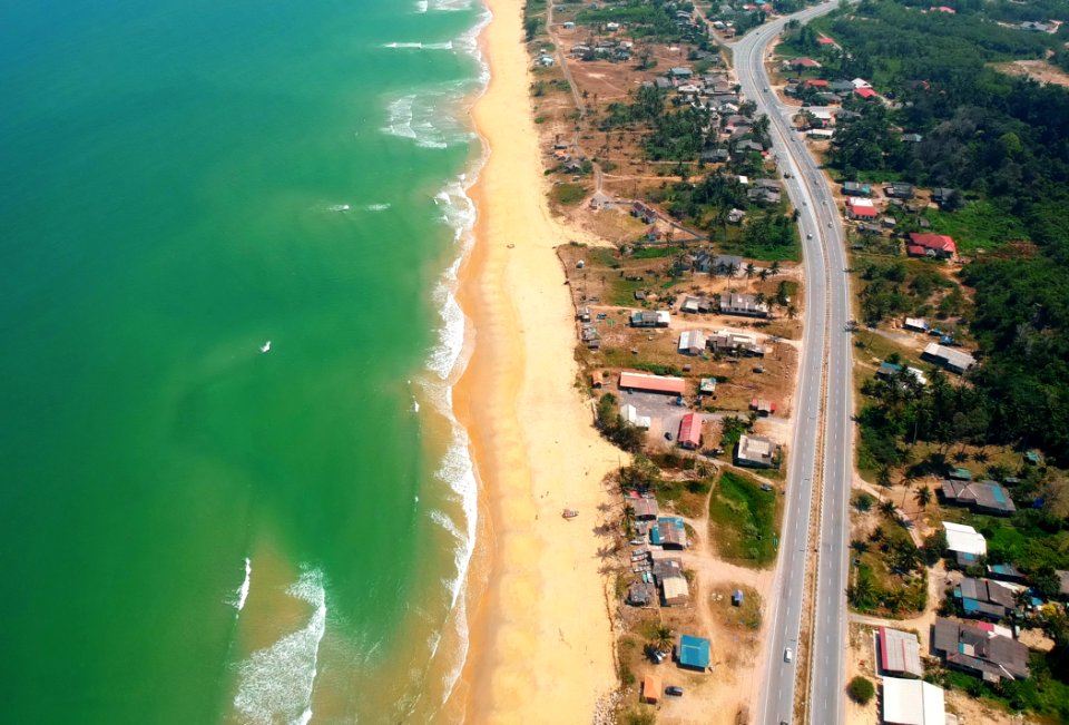 Top View Of Blue Sea And Brown Sand