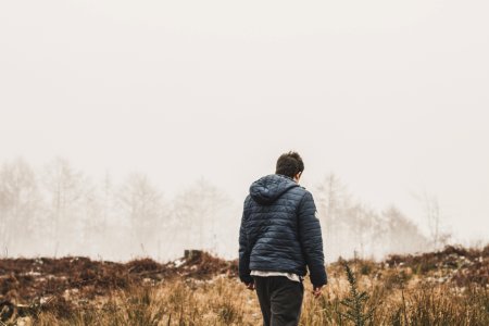 Man Wearing Blue Bubble Jacket photo