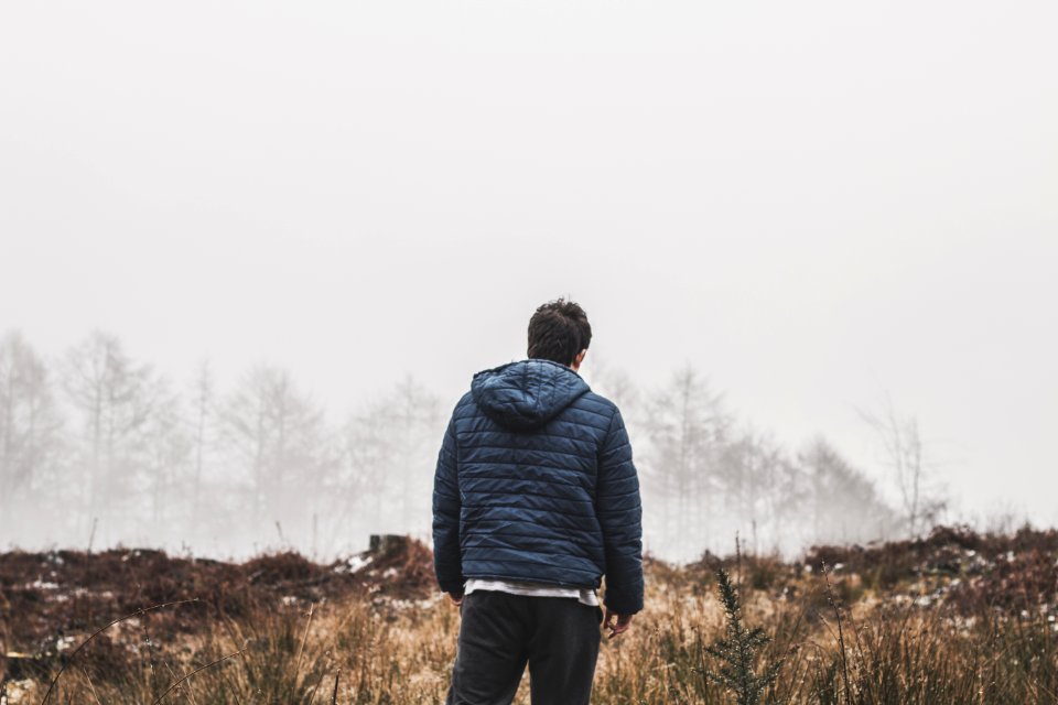 Man Wearing Blue Bubble Hooded Jacket photo