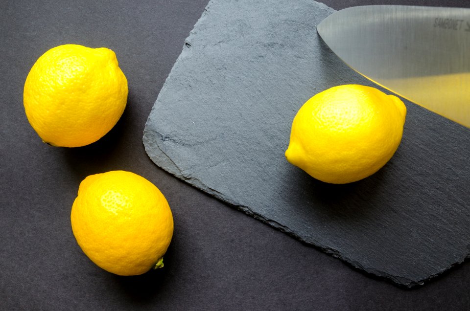 Three Lemons On Grey Surface