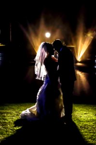 Silhouette Of Bride And Groom On Grass Field During Night Times