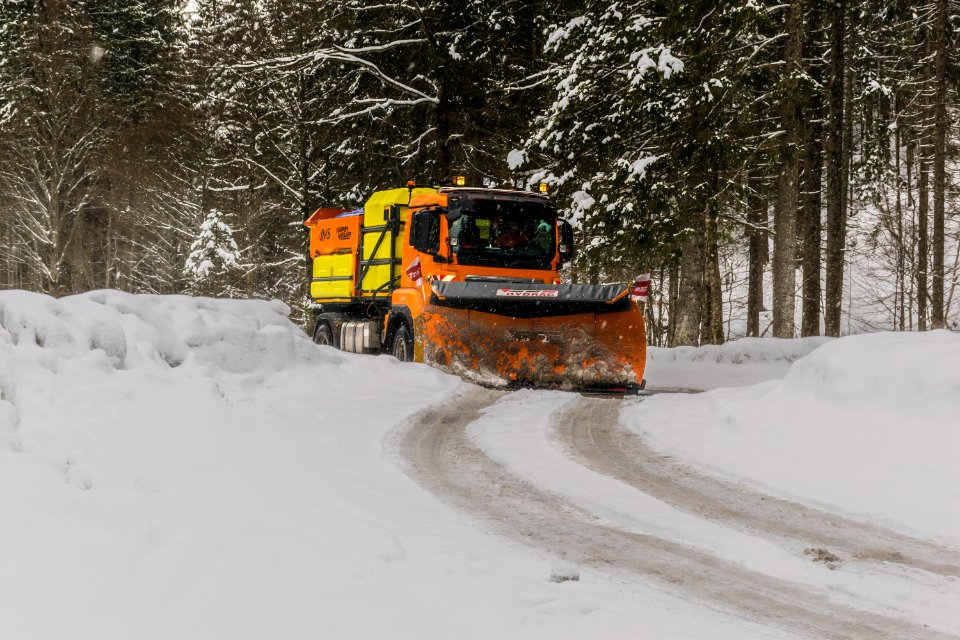 Yellow Orange And Black Truck Plowing Snow