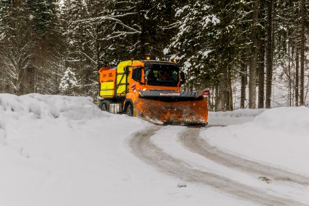 Yellow Orange And Black Truck Plowing Snow