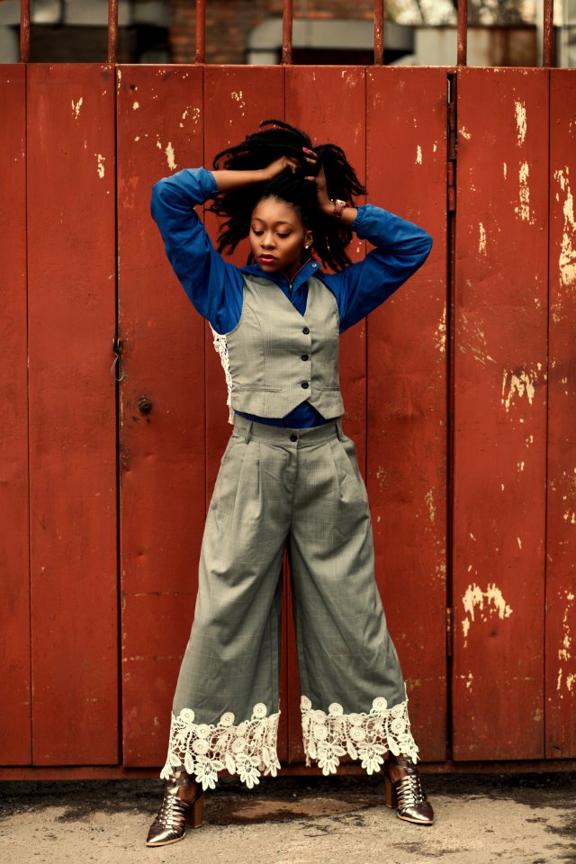 Woman Wearing Blue Dress Shirt Gray Waistcoat And Pants
