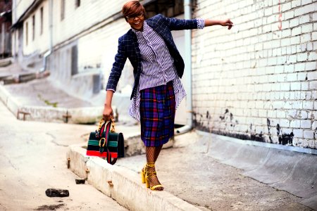 Person Wearing Blue And Black Blazer Holding Bag photo