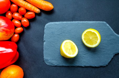 Sliced Lemon On Blue Chopping Board