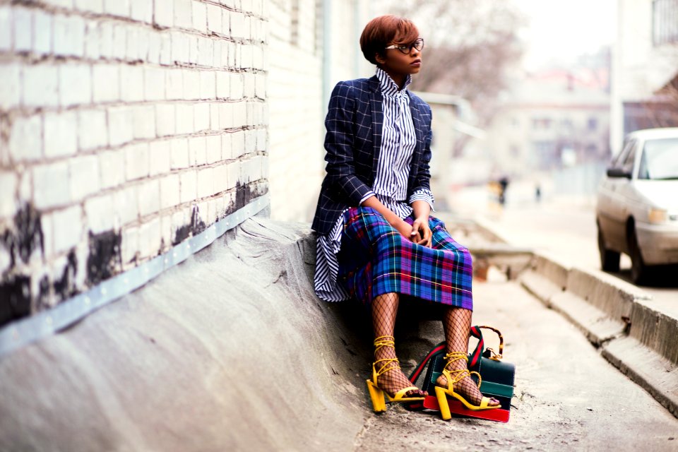 Woman Sitting Of Concrete Stair Near Gray Car