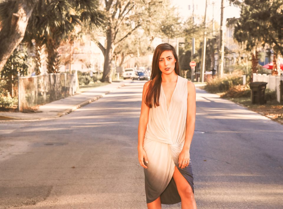 Woman In White And Black Ombre Sleeveless Dress