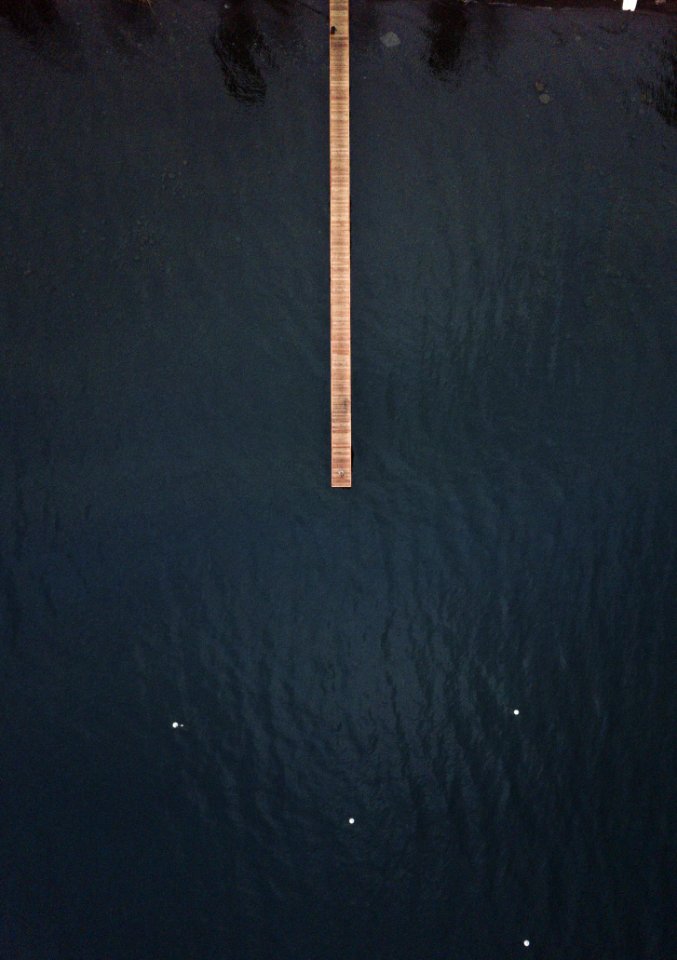 Brown Wooden Dock On Top Of Body Of Water
