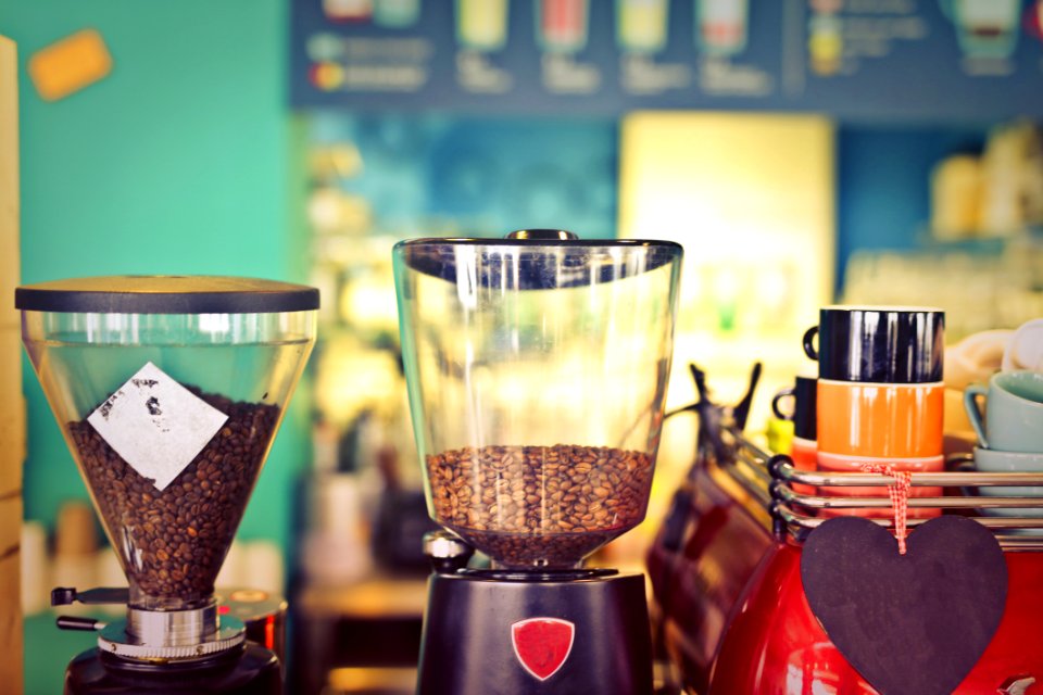 Two Clear Glass Coffee Makers Beside Black And Beige Ceramic Mug photo