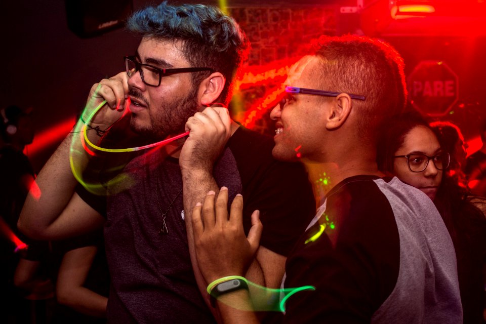 Two Man Wearing Eyeglasses Standing Under Red Led Light photo