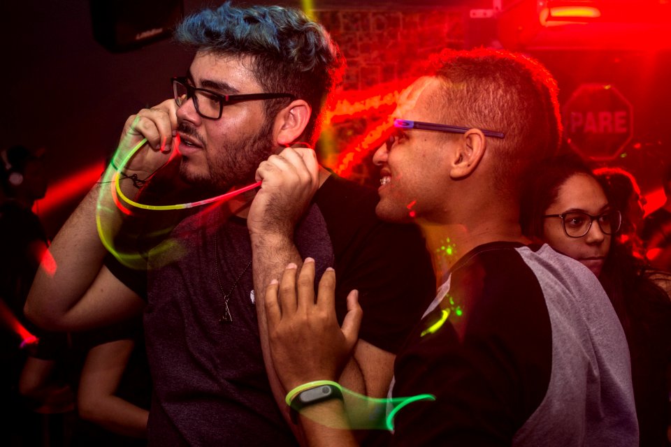 Two Man Wearing Eyeglasses Standing Under Red Led Light