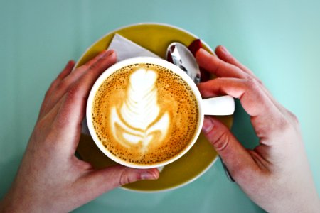 Person Holding White Ceramic Cup photo