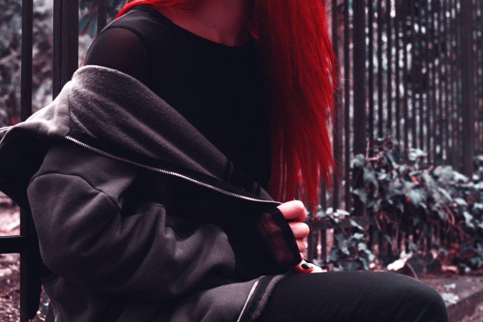 Woman In Black Zip-up Jacket Near Green Leaf Plant