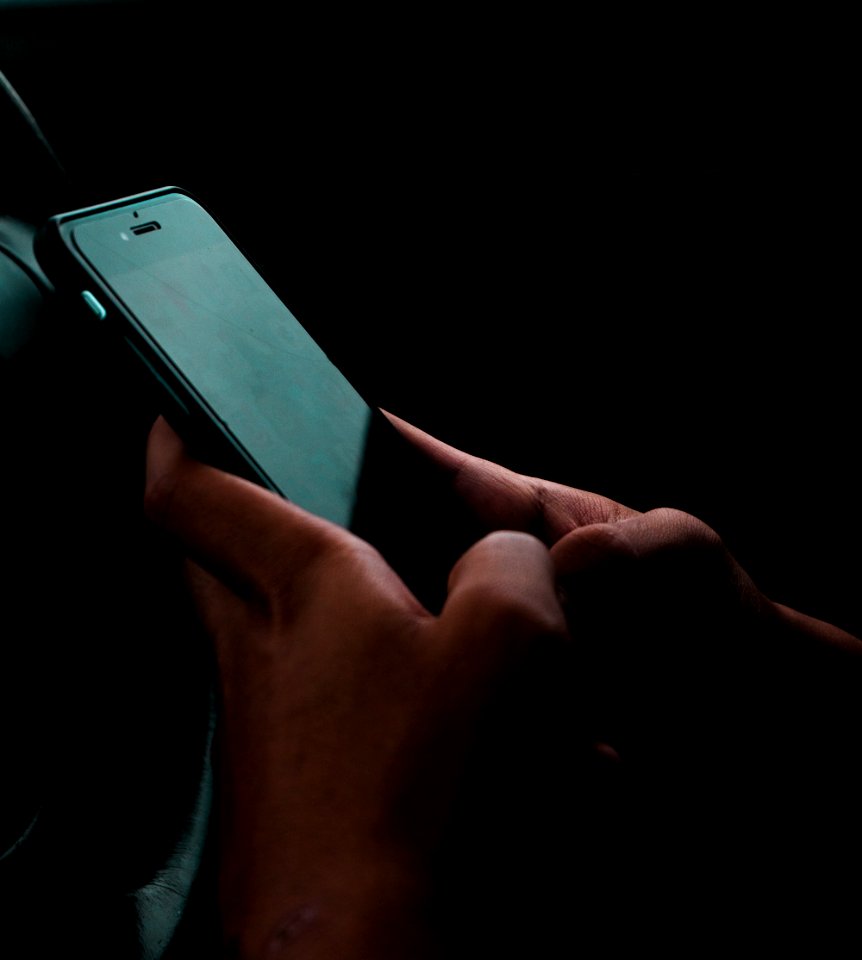 Person Holding Space Gray Iphone 6 And Black Case