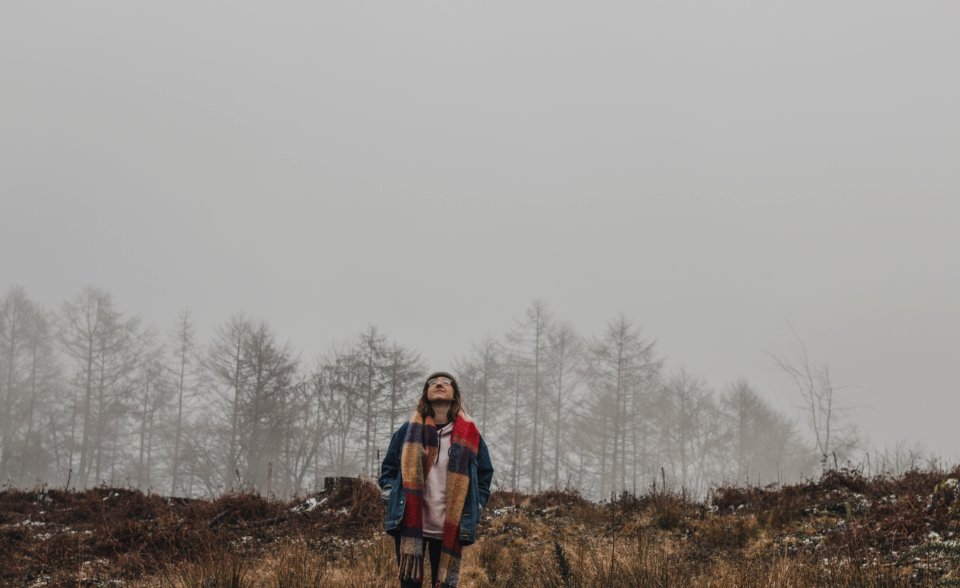 Person In Brown And Red Scarf