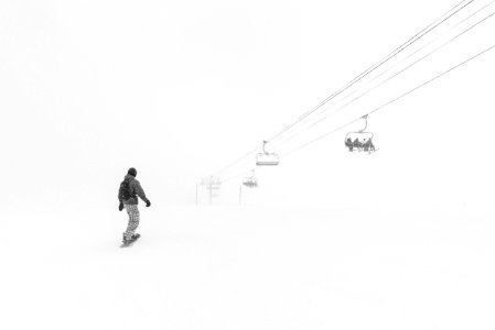 Man Walking In The Snow At Daytime photo