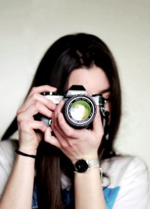 Woman Taking A Photo Using Dslr Camera photo