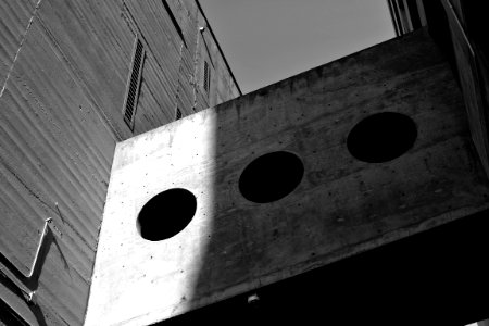 Grayscale Photography Of Board With Three Round Holes photo