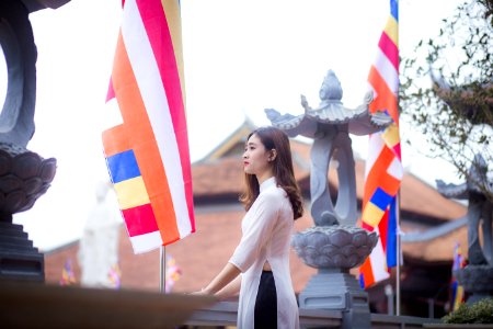 Photo Of Woman Standing On Bridge photo