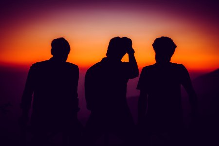 Silhouette Of Men Standing On Open Area Golden Hour Photography