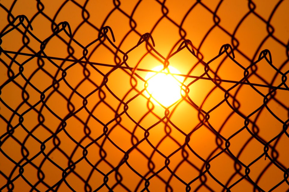 Sun Over The Cyclone Fence