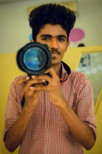 Man Holding Dslr Camera photo