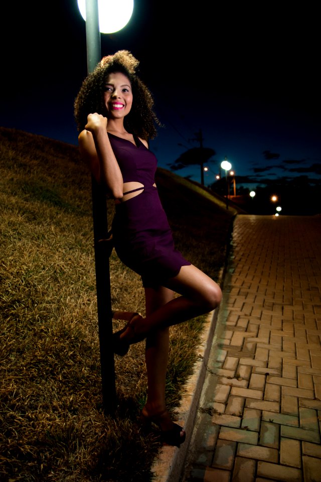 Woman Wearing Purple Dress Behind Gray Pole Photo