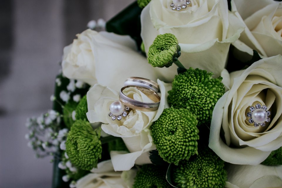 Red And Green Petaled Flowers Bouquet With Silver-colored Ring
