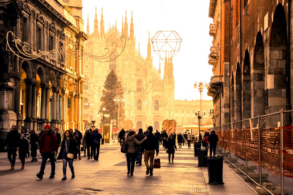 Group Of People In Between Buildings